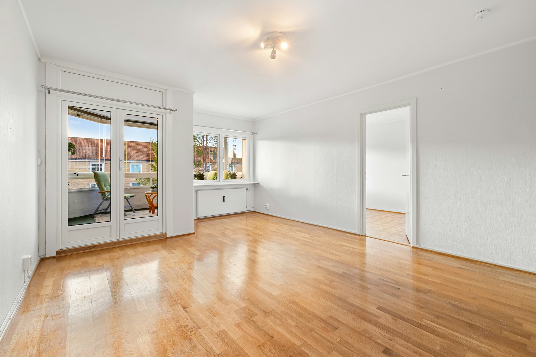 Completed golden oak floor in an empty room
