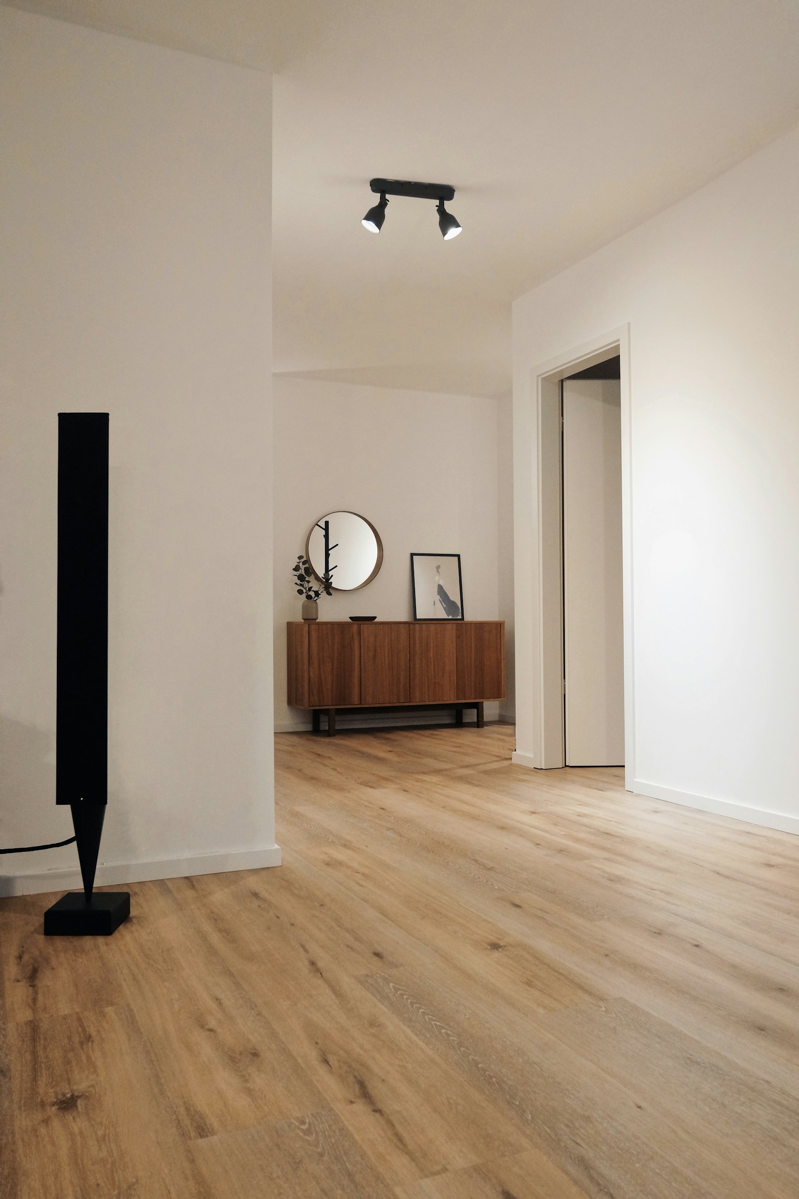 Light hardwood floor in a quiet hallway